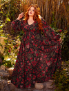 Wrap yourself in mystery with the Heroine Maxi Dress in Pomegranate Print, a hauntingly beautiful creation. The deep red hues and intricate design evoke the allure of forgotten realms and ancient secrets.