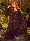 Indulge in gothic opulence with the Heroine Maxi Dress in Pomegranate Print. Its luxurious fabric and dramatic silhouette create a captivating aura, ideal for enchanting evenings and clandestine rendezvous.