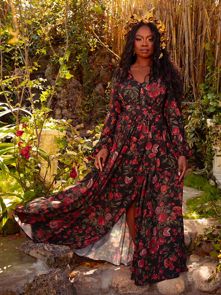 Wrap yourself in the Heroine Maxi Dress in Pomegranate Print, where gothic allure meets timeless elegance. Perfect for moonlit dances and shadowy gardens, it whispers tales of love and loss.