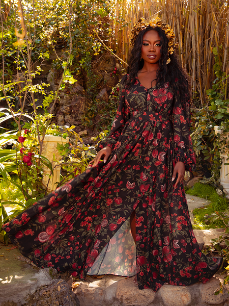 Embrace the gothic romance of the Heroine Maxi Dress in Pomegranate Print. Its deep red hues and dramatic silhouette create an air of mystery, perfect for enchanting evenings and clandestine rendezvous.