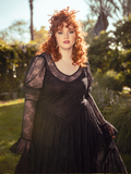 A vision of midnight romance, the Juliet Sheer Lace Maxi Dress in Black drapes the body in ethereal lace, a hauntingly elegant silhouette for moonlit soirees.