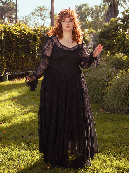 A sheer symphony of lace and shadow, the Juliet Maxi Dress in Black weaves mystery and allure, an unforgettable piece for twilight gatherings.