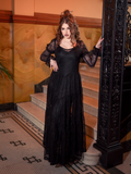 Shadows and lace entwine in the Juliet Sheer Lace Maxi Dress in Black, a garment woven with mystery for moonlit walks and forbidden romances.