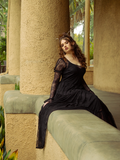 The Juliet Sheer Lace Maxi Dress in Black sways like midnight mist, its intricate lace detailing conjuring the spirit of gothic romance.