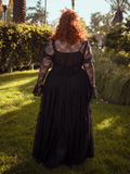 Draped in shadows and lace, the Juliet Sheer Lace Maxi Dress in Black evokes timeless beauty, a garment made for whispered secrets and starry nights.