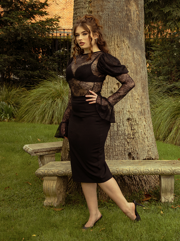 Romance and shadow entwine in the Juliet Lace Top in Black, a garment that embodies both delicate beauty and dark sophistication.