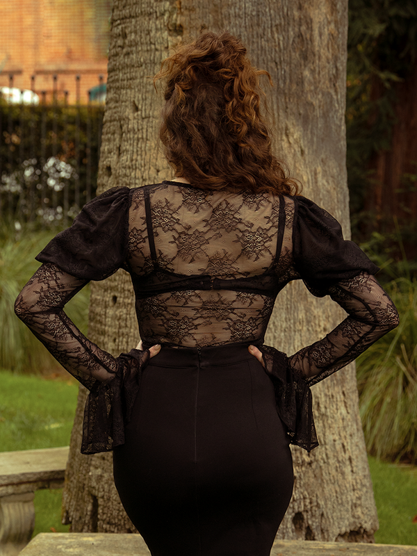 The Juliet Lace Top in Black is a symphony of lace and mystery, a piece that transforms any look into gothic enchantment.