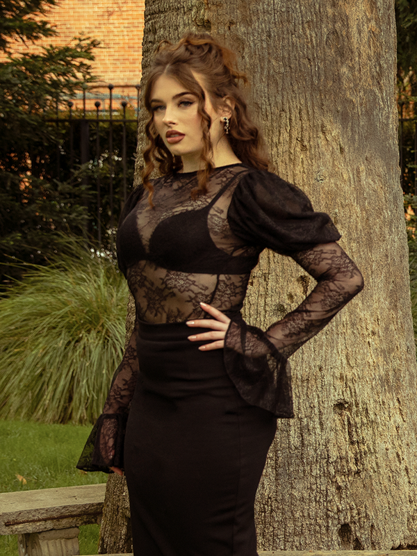 A portrait of elegance, the Juliet Lace Top in Black enchants with sheer lace detailing, perfect for evenings of mystery and allure.