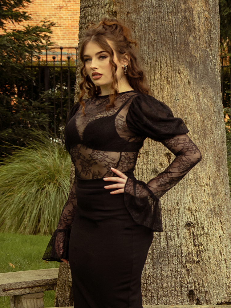 A portrait of elegance, the Juliet Lace Top in Black enchants with sheer lace detailing, perfect for evenings of mystery and allure.