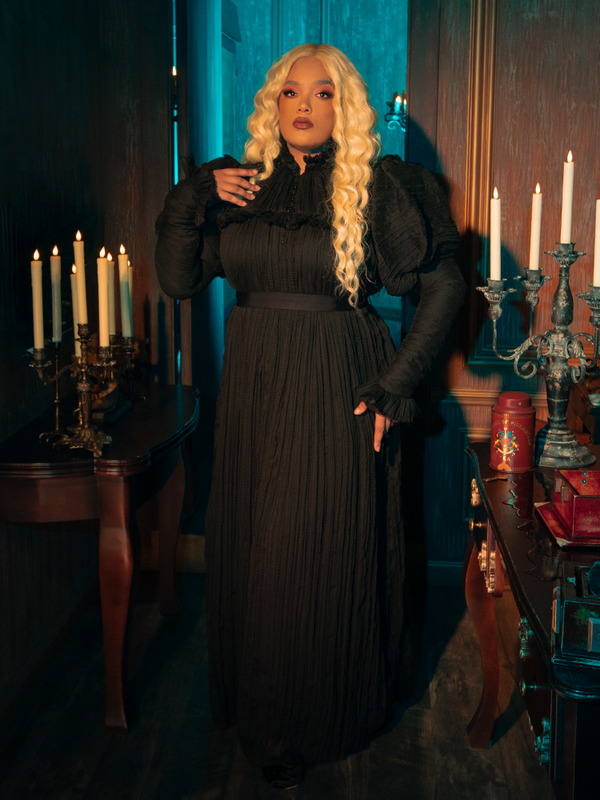  In the Lady Mourning Victorian Gown, the soft whisper of velvet meets the intricate whisper of lace, creating a harmony of textures that feels both luxurious and haunting. This gown, perfect for evenings draped in mystery, wraps you in a story of timeless elegance and deep, unspoken desires.