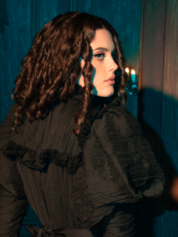 Clothe yourself in the Specter's Embrace with the Lady Mourning Victorian Gown. This garment, with its flowing velvet and ghostly lace, feels like a caress from another world. It's an invitation to walk the line between the seen and the unseen, the known and the mysterious.
