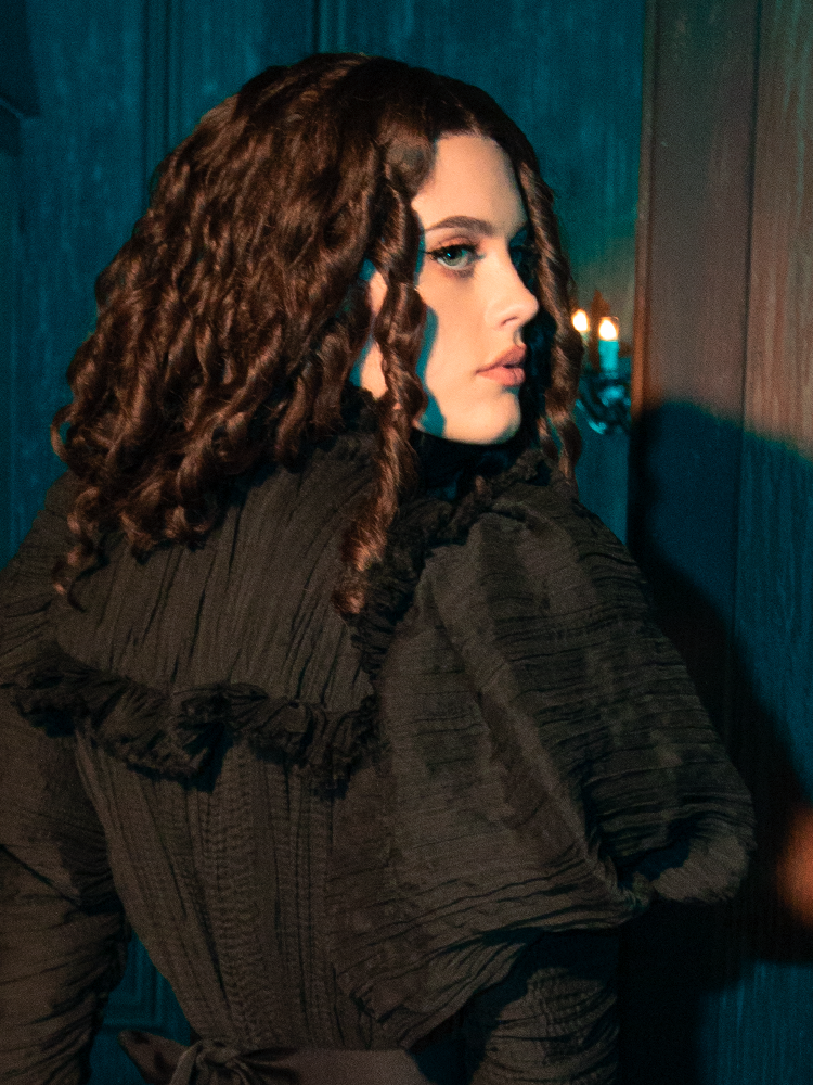 Clothe yourself in the Specter's Embrace with the Lady Mourning Victorian Gown. This garment, with its flowing velvet and ghostly lace, feels like a caress from another world. It's an invitation to walk the line between the seen and the unseen, the known and the mysterious.