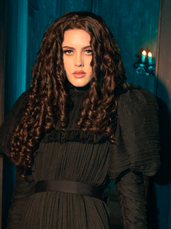 The Lady Mourning Victorian Gown in Black is not just a garment; it's an illusion woven from the threads of the past. Its silhouette harks back to a bygone era, offering a modern twist on the classic Victorian mourning dress. This gown promises to be the centerpiece of any gothic wardrobe, a true testament to the allure of historical fashion.