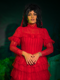 Step into your dark fairytale with the Beetlejuice™ Lydia Deetz Wedding Dress in Red. With its striking red tulle and Victorian-inspired lace details, this gown is a bold ode to gothic glamour, perfect for brides who defy tradition and crave dramatic elegance.