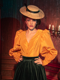 Step into the shadows with models showcasing the hauntingly gorgeous Taffeta Edwardian Blouse in Marigold, a masterpiece from the gothic clothing brand La Femme en Noir.