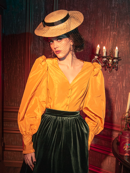 Embrace the dark elegance with models presenting the hauntingly gorgeous Taffeta Edwardian Blouse in Marigold from the gothic clothing brand La Femme en Noir.