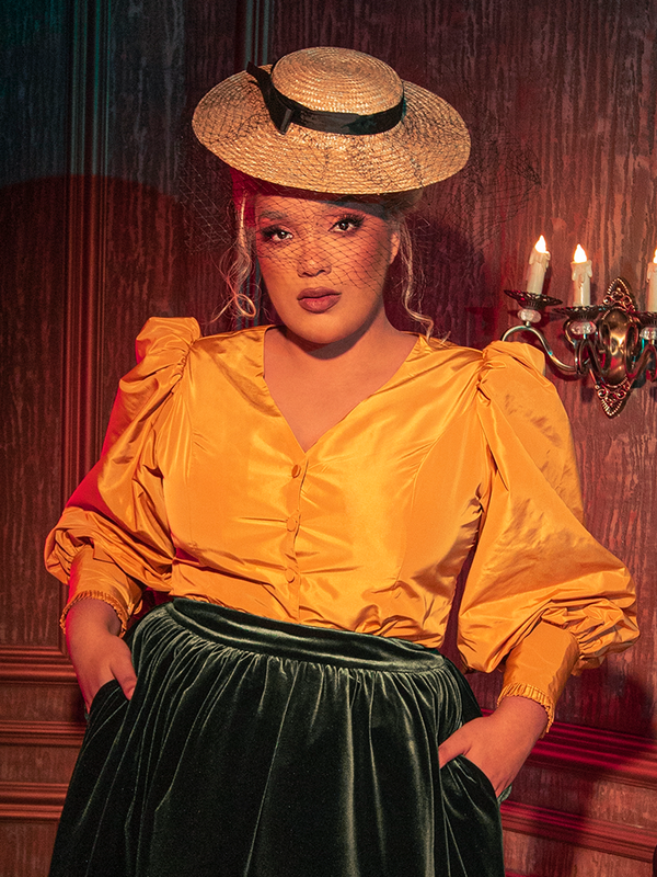 Witness the allure of the hauntingly gorgeous Taffeta Edwardian Blouse in Marigold as models bring it to life for La Femme en Noir, the gothic clothing brand.