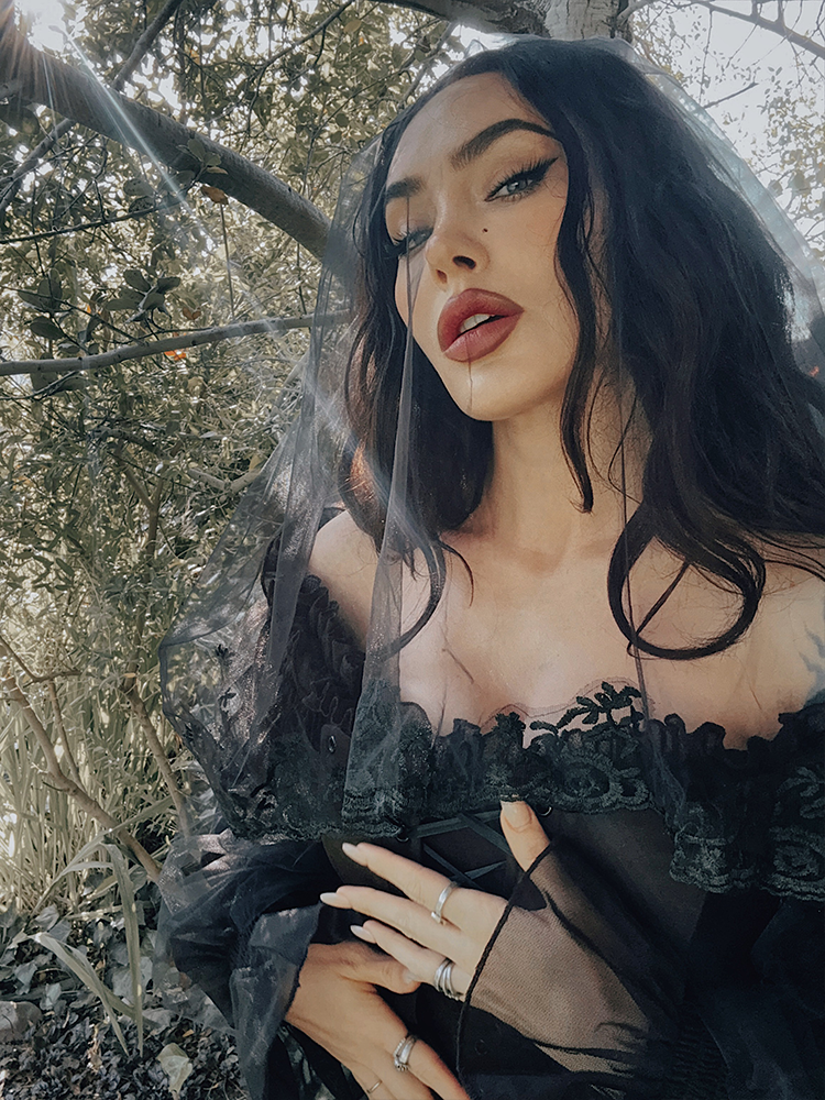 Close-up of the high-quality rayon/nylon ponte fabric, showcasing the rich, ink-black texture that defines La Femme en Noir’s signature dark elegance.