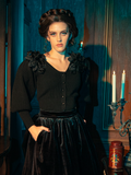 Gothically glamorous female models exude sophistication while modeling the Victorian Mourning Knit Cardigan in Black, displaying its versatility through poses.