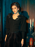 Gothically stunning female models showcase the Victorian Mourning Knit Cardigan in Black, striking a range of captivating poses.