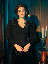 The Victorian Mourning Knit Cardigan in Black is elegantly modeled by gothically gorgeous female models, portraying its allure through various poses.