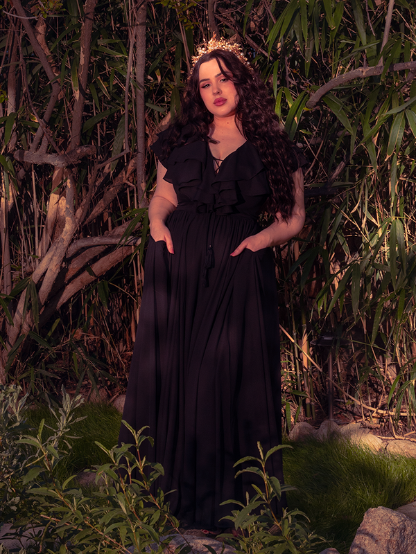 The hauntingly beautiful rear view of the Black Mythical Goddess Gown, where flowing fabric trails like shadows, perfect for a Whimsigoth gala or a moonlit ritual.