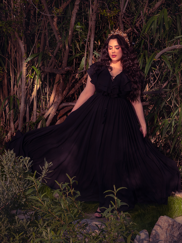 A breathtaking vision of the Mythical Goddess Gown in Black, featuring a sweeping floor-length skirt and ethereal draping that embodies dark elegance and high-fashion Victorian Goth opulence.
