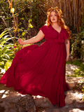 Radiant as a blood moon, the Mythical Goddess Crimson Dress envelops you in a cascade of deep red velvet. With a corseted bodice and ethereal lace sleeves, this gown whispers of ancient magic and passion. Perfect for moonlit dances and enchanting soirées.