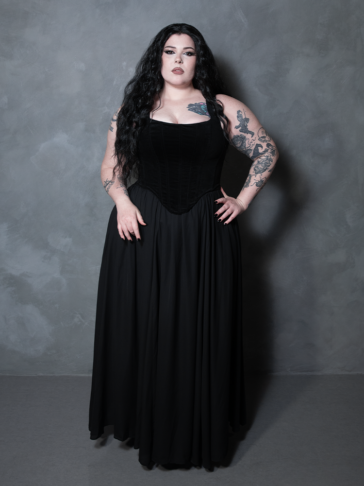 Wrapped in midnight enchantment, a female model channels a deep, poetic romance while showcasing a premium black chiffon skirt designed for the unapologetic dark vixen.