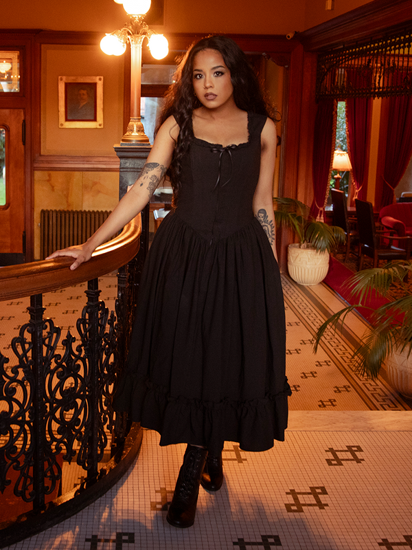 Soft chiffon layers drift like night fog as obsidian lace caresses every contour—an ode to the gothic heart’s eternal bloom.