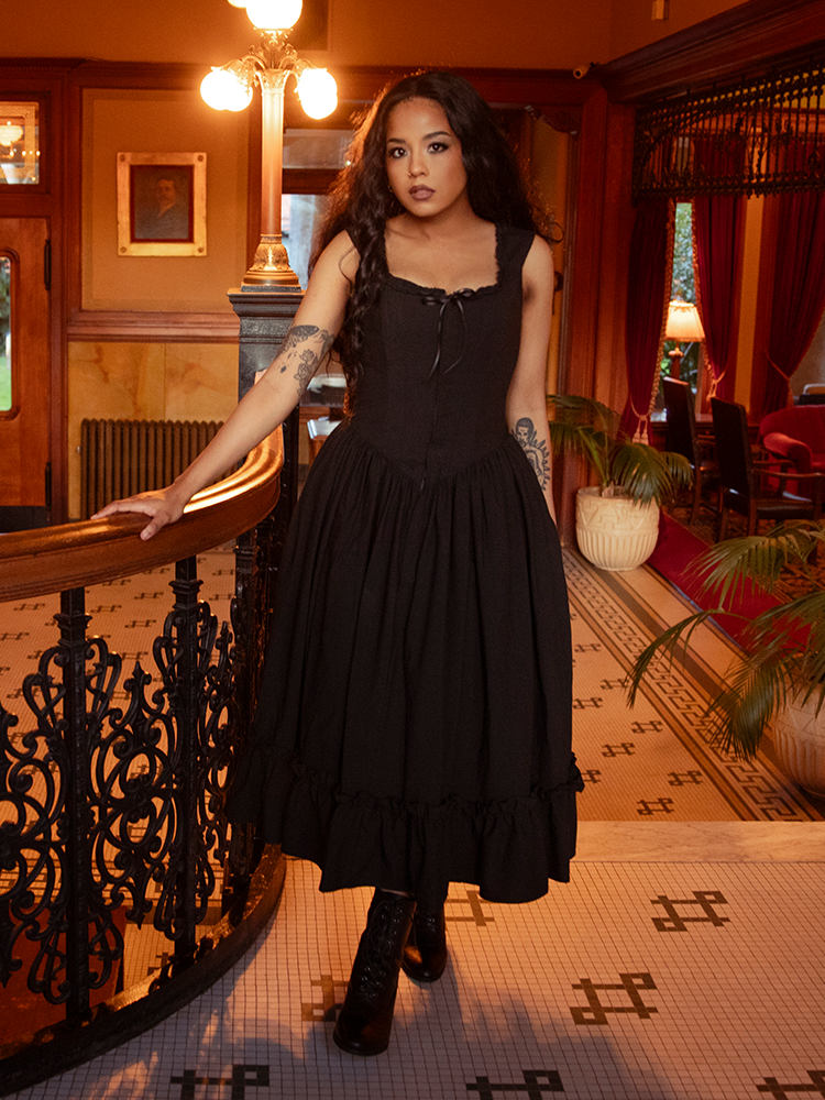 Soft chiffon layers drift like night fog as obsidian lace caresses every contour—an ode to the gothic heart’s eternal bloom.