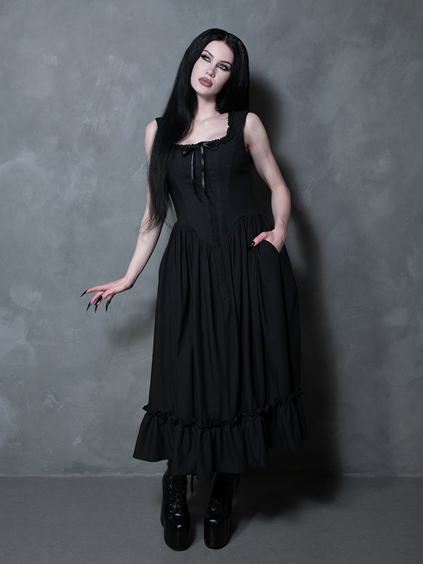 Exuding an irresistible, mysterious charm, a female model perfectly defines gothic style clothing in the Nightshade Underpinning Dress in Antique Black.