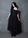 The essence of a gothic femme fatale is brought to life as a female model wears the seductive Nightshade Underpinning Dress in Antique Black.