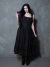 A female model channels a ghostly, romantic poetry while draped in the breathtaking Nightshade Underpinning Dress in Antique Black.