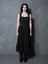A female model stands as a testament to timeless alternative beauty in the Nightshade Underpinning Dress in Antique Black.