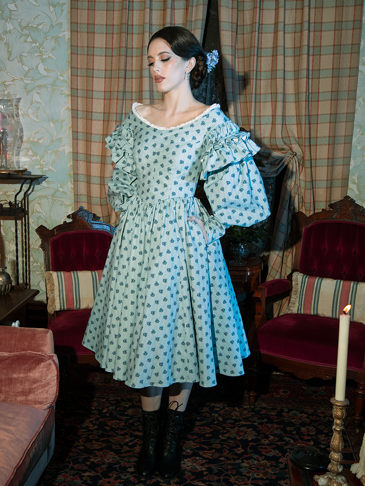 Ethereal yet bold, this dress’s blue floral design and Victorian cut create a look that’s equal parts haunting and breathtaking.