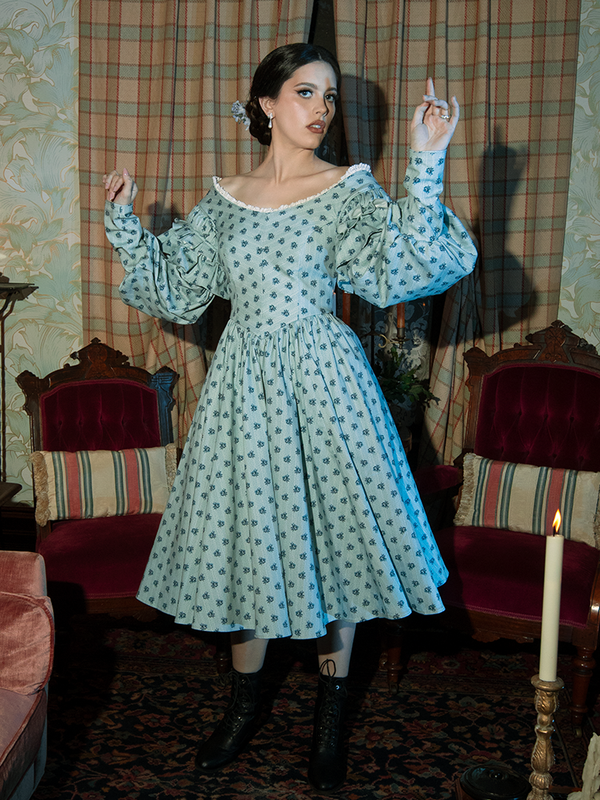 Channel vintage allure with the Ellen Victorian Dress, adorned with a blue floral print that complements its gothic-inspired silhouette.