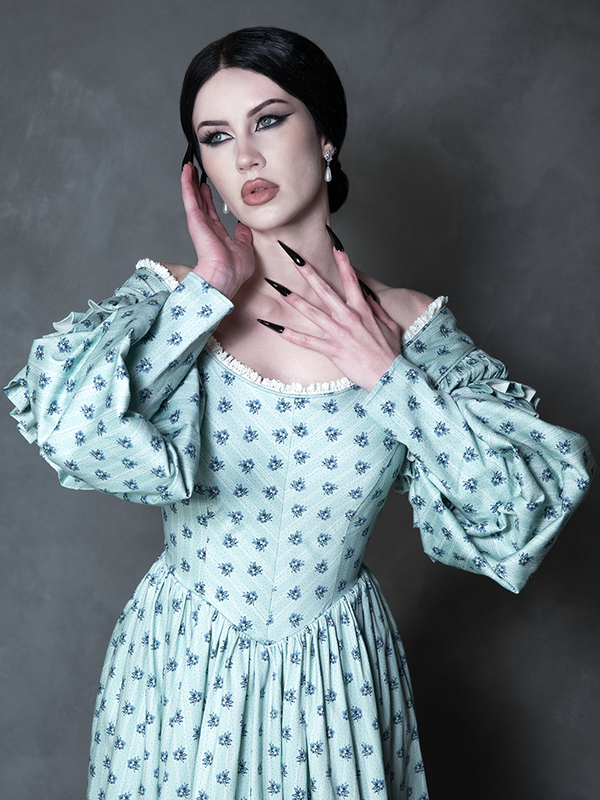 A captivating look that breathes new life into Victorian Goth aesthetics, featuring a model in a beautifully crafted gothic fashion dress destined for twilight hours.