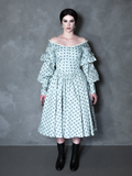 A gothic glamour muse radiates sophisticated darkness, her romantic alternative outfit perfectly complemented by an intricate, vintage-inspired patterned gown.