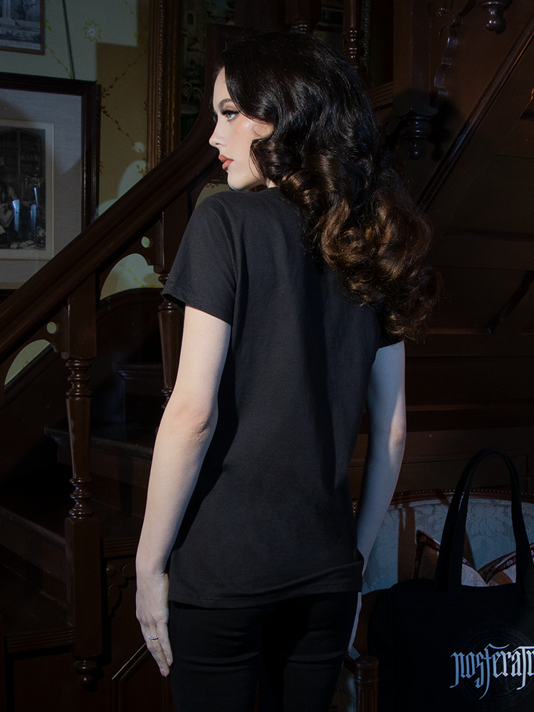 Wrap yourself in gothic allure with the NOSFERATU Occult Fitted T-shirt. Its black silhouette and arcane sigil design elevate your shadowy wardrobe.