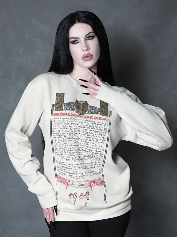 Exuding an exquisite Victorian Goth aesthetic, a female model seamlessly blends vintage darkness with modern alternative fashion in a hauntingly elegant graphic sweatshirt.