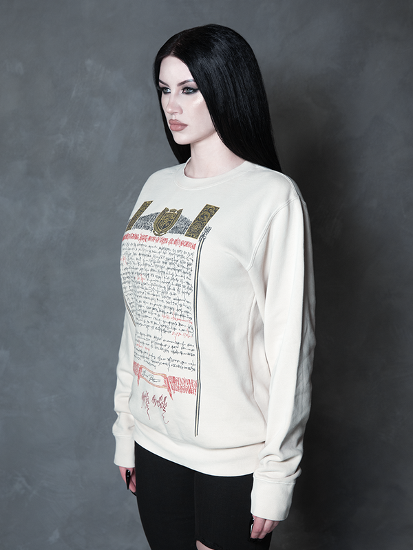 Enveloped in nocturnal mystery, a model styled in dramatic gothic clothing captures the ultimate essence of classic noir horror with a striking, comfortable bone-white pullover.