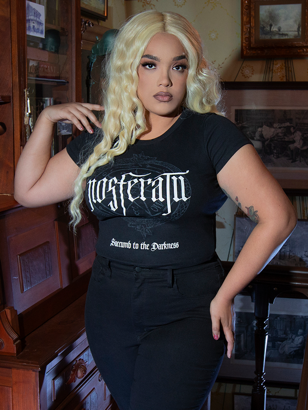 A captivating look that breathes new life into Victorian Goth aesthetics, featuring a model in a beautifully tailored gothic fashion top destined for twilight hours.