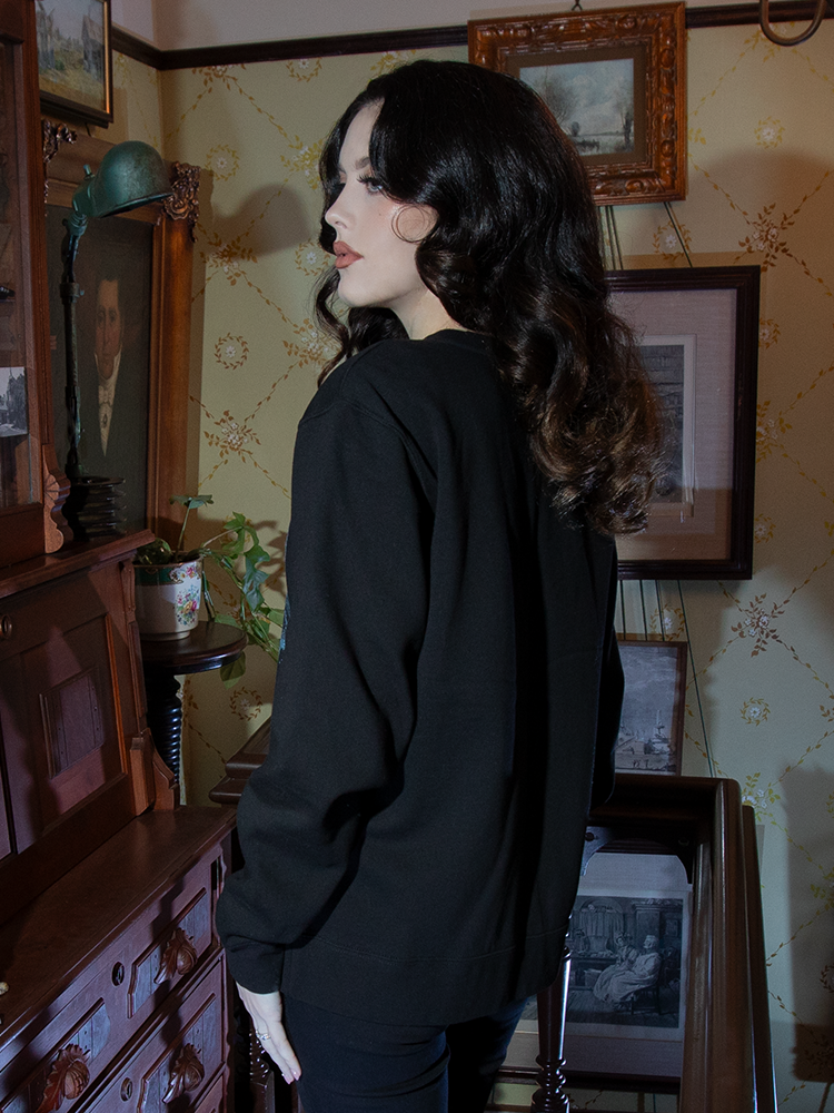 Envelop yourself in timeless gothic allure with this sweatshirt. The Nosferatu castle design on rich black fabric evokes chilling yet cozy sophistication.

