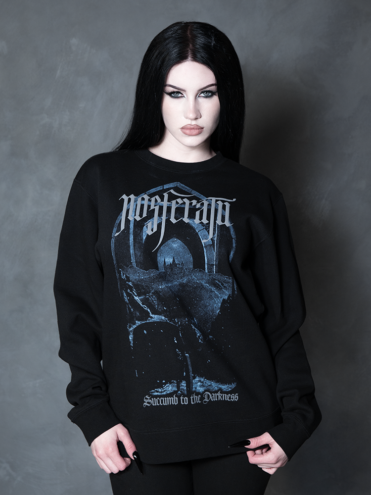 Exuding an exquisite Victorian Goth aesthetic, a female model seamlessly blends vintage darkness with modern alternative fashion in a hauntingly elegant graphic sweatshirt.