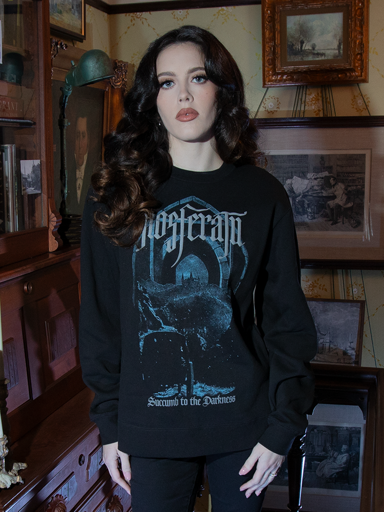 The Nosferatu Castle Sweatshirt features a soft, relaxed fit and a bold, shadowy castle graphic, bringing dark refinement to casual attire.