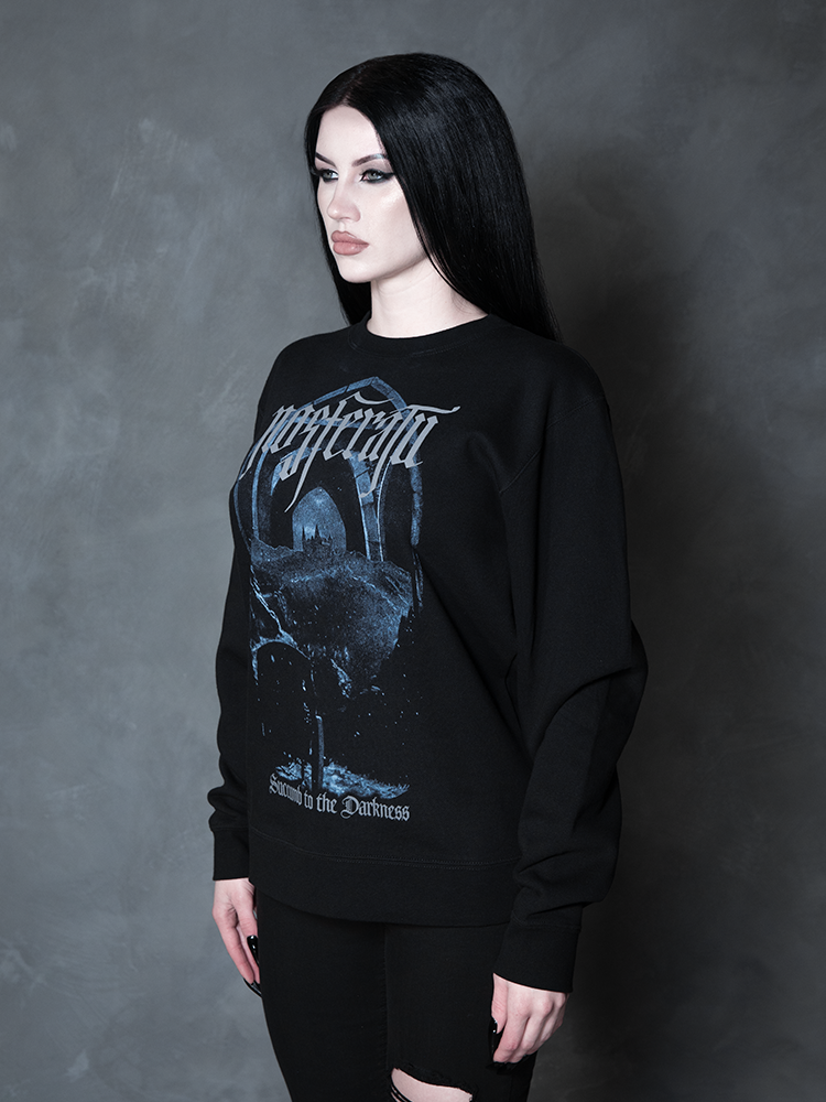 Enveloped in nocturnal mystery, a model styled in dramatic gothic clothing captures the ultimate essence of classic noir horror with a striking, comfortable black pullover.
