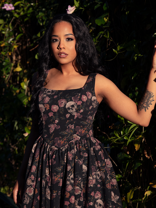 A hauntingly chic silhouette, the Novella Mini Dress in Decayed Beauty Print entwines florals and shadows in a tapestry of gothic romance.