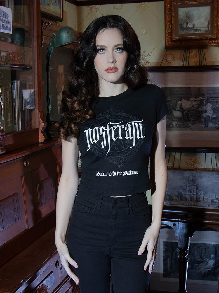 A tribute to vintage horror, this Nosferatu Baby Doll Tee showcases Count Orlock's sigil on soft, breathable black cotton, perfect for haunting day or night.