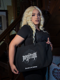 The Count Orlock Sigil Tote Bag in Black is a gothic essential. Its robust build carries your world, while the eerie sigil design channels a subtle, arcane allure.